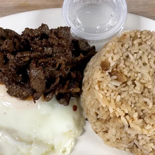 Tapsilog served with garlic rice and fried egg